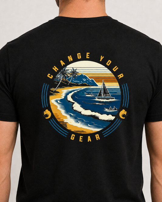 Close-up back view of The Passage Black 2theSEA T-shirt showing the large shoreline, sailboat and wave graphic.