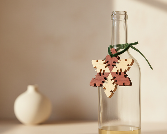 Wooden snowflake ornaments with wine bottle as gift tag