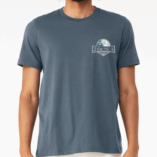Front view of 2theSEA BEACH HOUSE T-Shirt in Slate Blue featuring the small coastal badge graphic on the left chest.
