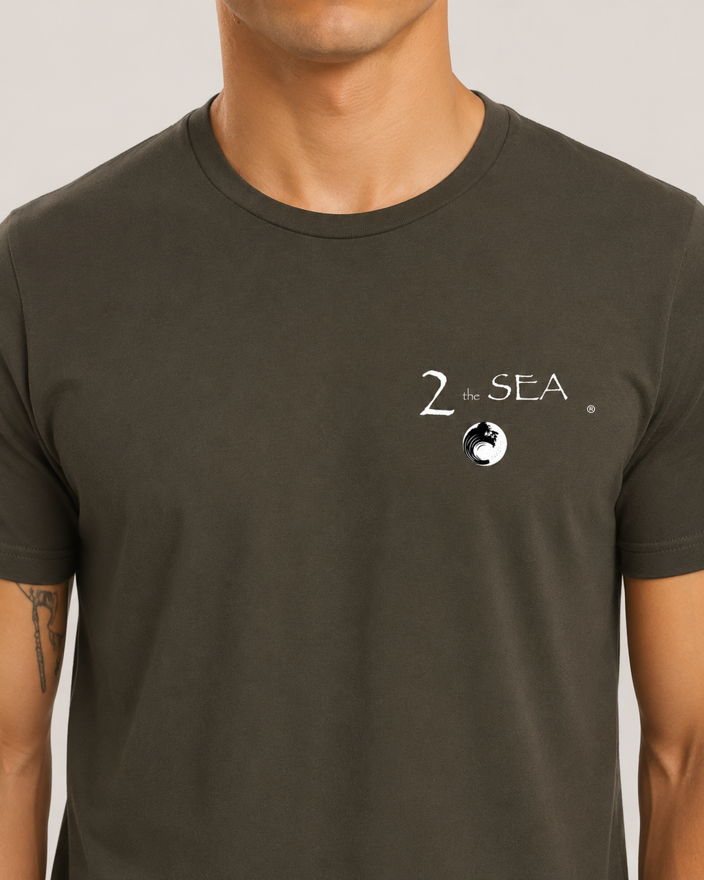 Close-up front view of The Break Army 2theSEA T-shirt showing the wave logo graphic on the left chest.