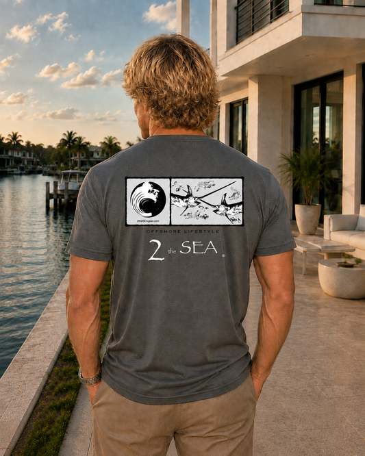 Back lifestyle view of the Bluewater Asphalt Gray 2theSEA T-shirt featuring the large offshore rectangular panel graphic in a waterfront setting.