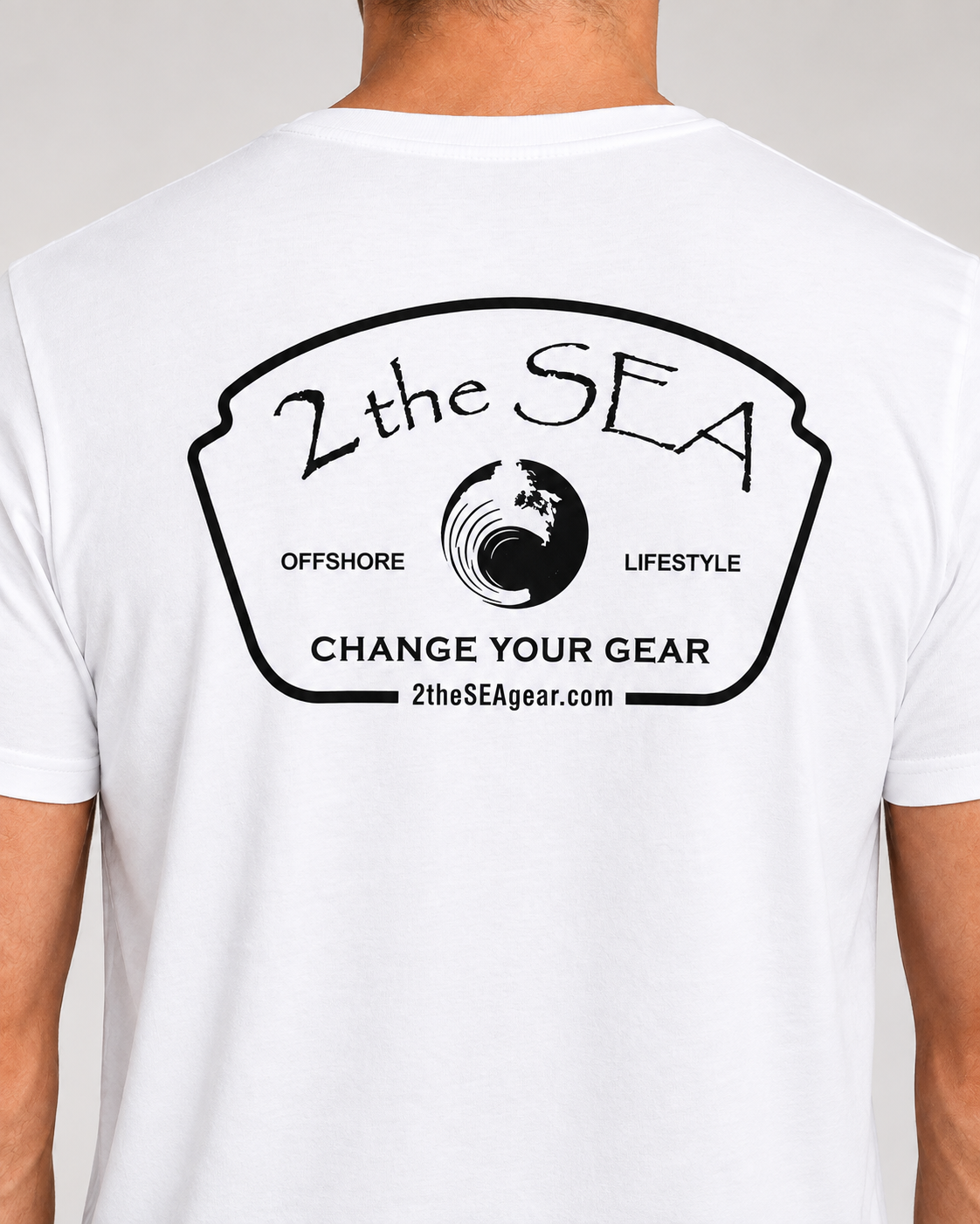 Close-up back view of The Mark white 2theSEA T-shirt showing the large black Change Your Gear badge graphic.