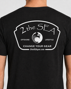 Close-up back view of The Mark dark grey 2theSEA T-shirt showing the large light Change Your Gear badge graphic.