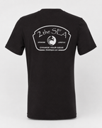 Studio back view of The Mark dark grey 2theSEA T-shirt featuring the large light Change Your Gear badge graphic centered on the back.