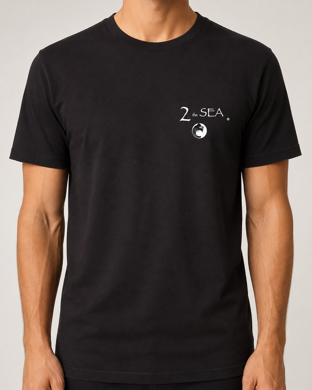 Close-up front view of The Crossing Black 2theSEA T-shirt showing the small 2theSEA graphic on the left chest.