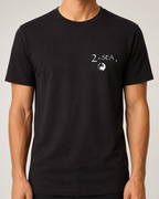 Close-up front view of The Crossing Black 2theSEA T-shirt showing the small 2theSEA graphic on the left chest.