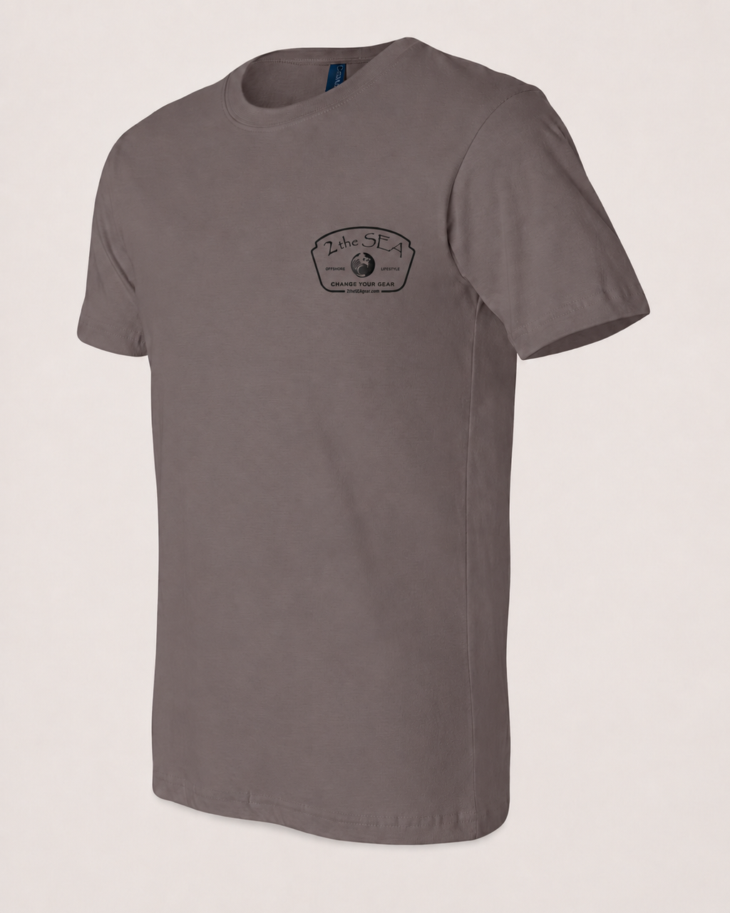 Studio front view of The Mark Pebble Brown 2theSEA T-shirt featuring the black Change Your Gear badge graphic on the left chest.