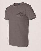 Studio front view of The Mark Pebble Brown 2theSEA T-shirt featuring the black Change Your Gear badge graphic on the left chest.