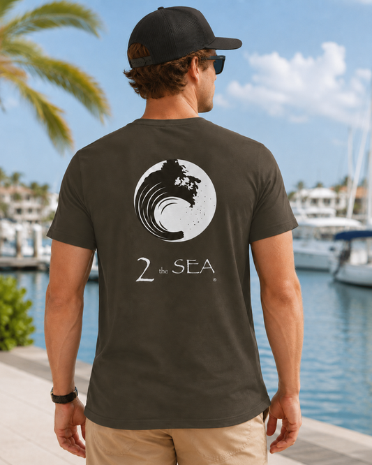 Back lifestyle view of The Break Army 2theSEA T-shirt featuring the large wave logo graphic in a marina setting.