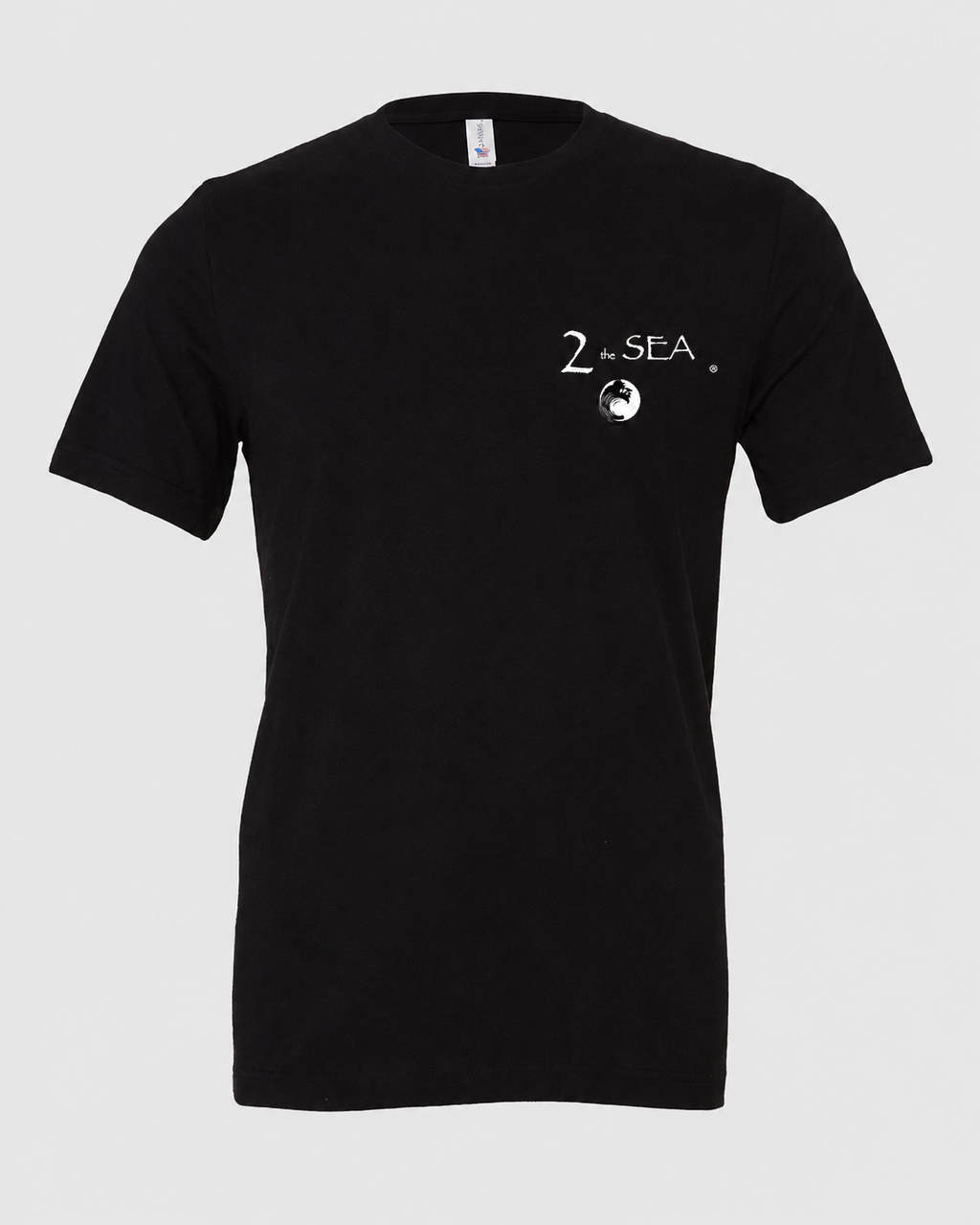 Studio front view of The Crossing Black 2theSEA T-shirt featuring the small 2theSEA graphic on the left chest.