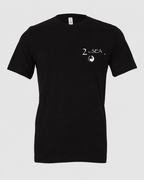 Studio front view of The Crossing Black 2theSEA T-shirt featuring the small 2theSEA graphic on the left chest.