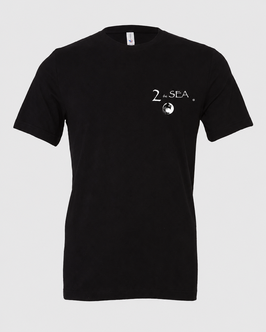 Studio front view of The Crossing Black 2theSEA T-shirt featuring the small 2theSEA graphic on the left chest.