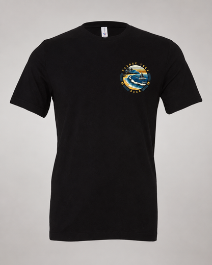 Studio front view of The Passage Black 2theSEA T-shirt featuring the shoreline, sailboat and wave graphic on the left chest.