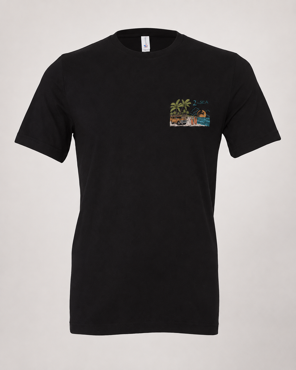 Front lifestyle view of The Departure Black 2theSEA T-shirt featuring the small Change Your Gear beach graphic on the left chest.
