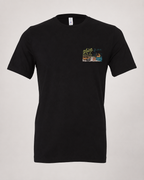 Front lifestyle view of The Departure Black 2theSEA T-shirt featuring the small Change Your Gear beach graphic on the left chest.